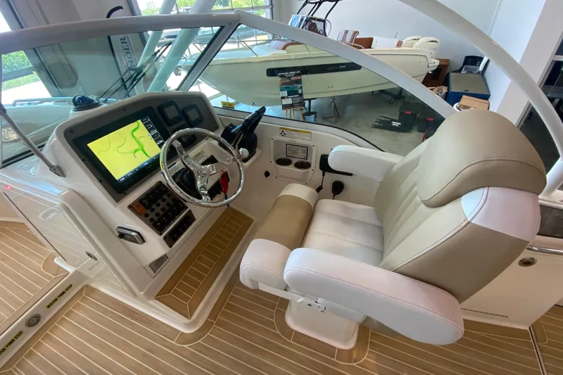 Slide: The Image of 2016 World Cat Glacier Bay Edition 2740 Dual Console helm with navigation display and captain's chair. - 42