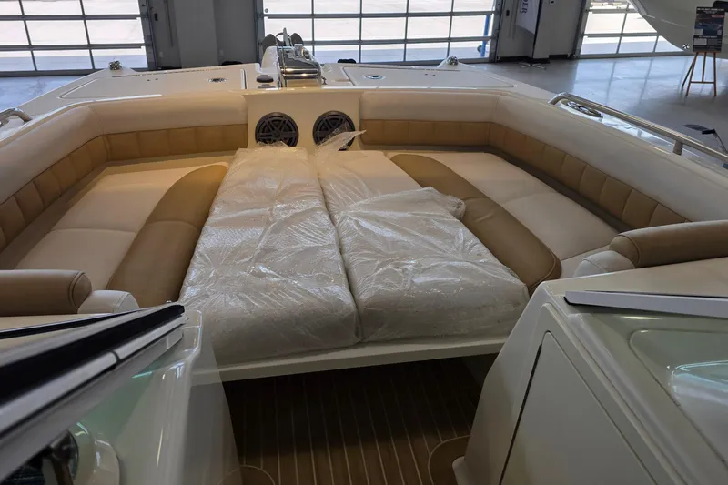 Slide: The Image of 2016 World Cat Glacier Bay Edition 2740 Dual Console interior with cushioned seating and speakers. - 59