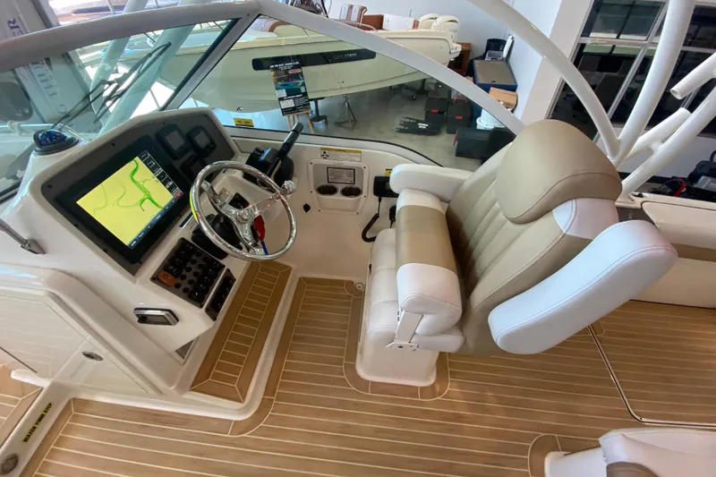 Slide: The Image of 2016 World Cat Glacier Bay Edition 2740 Dual Console helm with navigation display and captain's chair. - 43