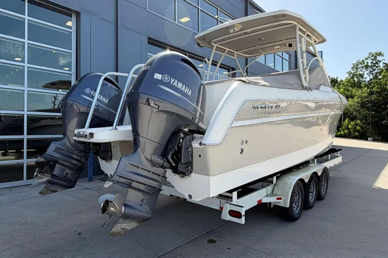 Slide: The Image of 2016 World Cat Glacier Bay Edition 2740 Dual Console boat with Yamaha engines on trailer. - 3