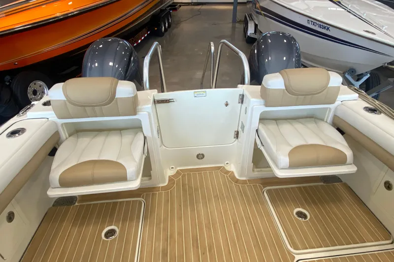 Slide: The Image of 2016 World Cat Glacier Bay Edition 2740 Dual Console boat interior with seating and teak flooring. - 38