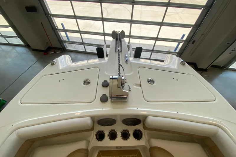 Slide: The Image of 2016 World Cat Glacier Bay Edition 2740 Dual Console boat interior, featuring deck and seating area. - 57