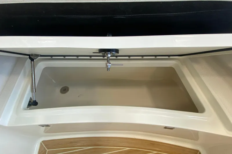 Slide: The Image of Storage compartment of 2016 World Cat Glacier Bay Edition 2740 Dual Console boat. - 55