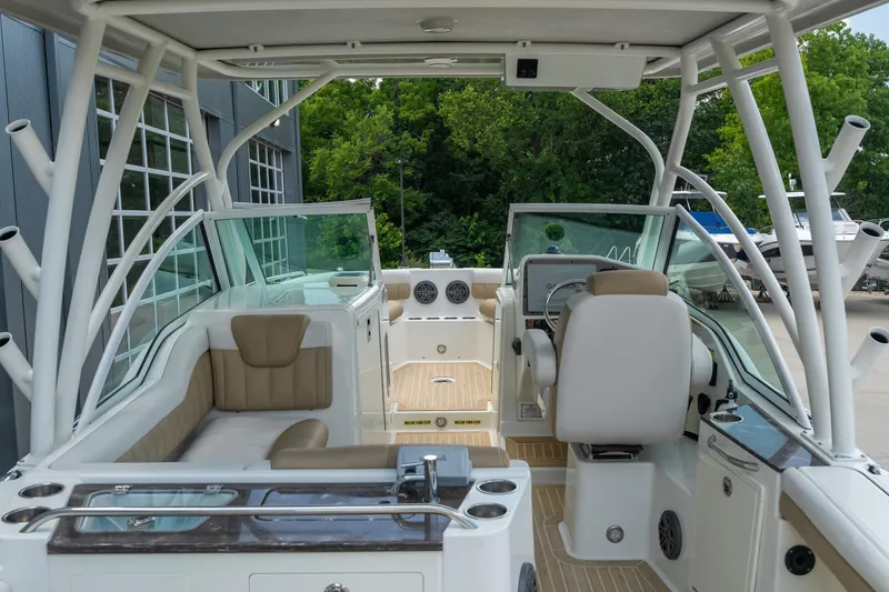 Slide: The Image of 2016 World Cat Glacier Bay Edition 2740 Dual Console boat interior with seating and helm. - 10
