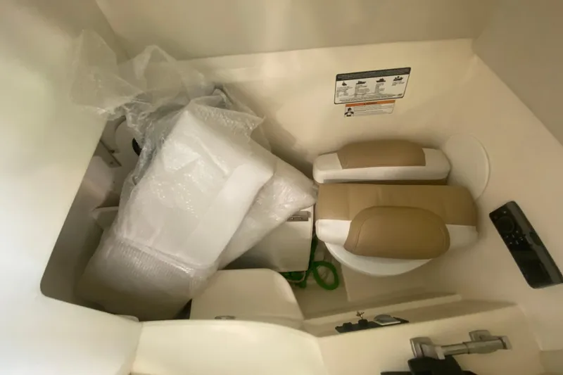 Slide: The Image of Interior of 2016 World Cat Glacier Bay Edition 2740, featuring seats and wrapped items. - 60