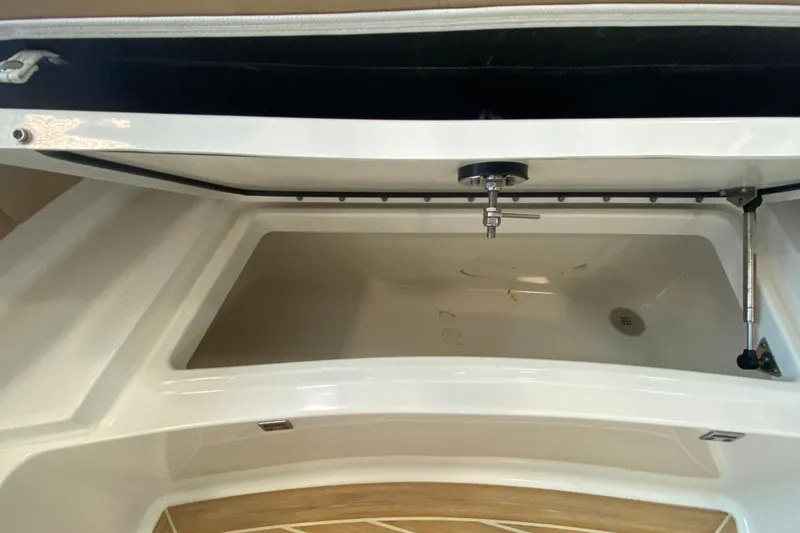 Slide: The Image of Storage compartment of 2016 World Cat Glacier Bay Edition 2740 Dual Console boat. - 56