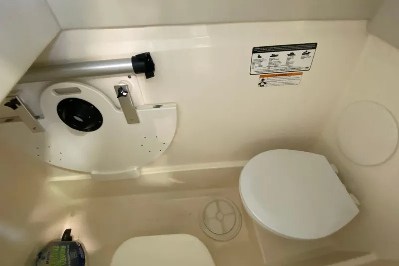 Slide: The Image of Interior of 2016 World Cat Glacier Bay Edition 2740, featuring a compact marine toilet. - 36