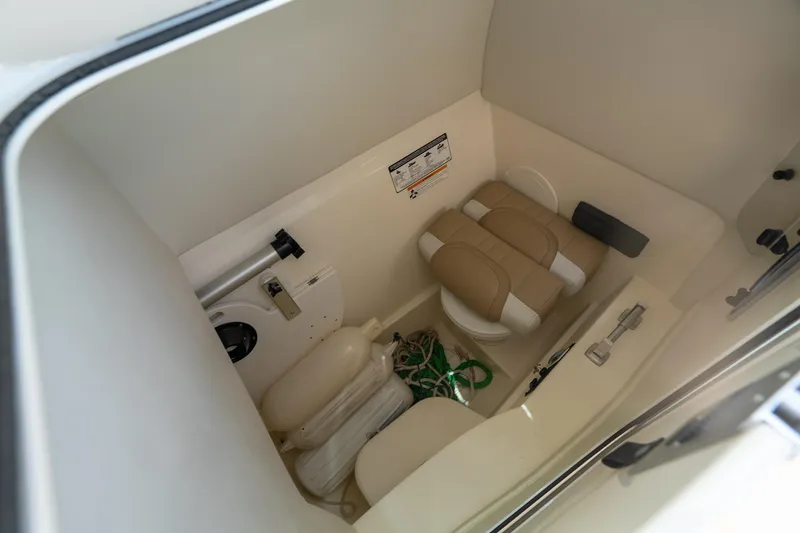 Slide: The Image of Interior of 2016 World Cat Glacier Bay Edition 2740 boat, featuring compact storage and seating. - 17