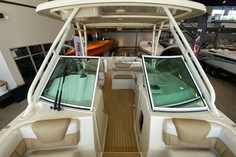 Slide: The Image of 2016 World Cat Glacier Bay Edition 2740 Dual Console boat interior with seating and windshield. - 58