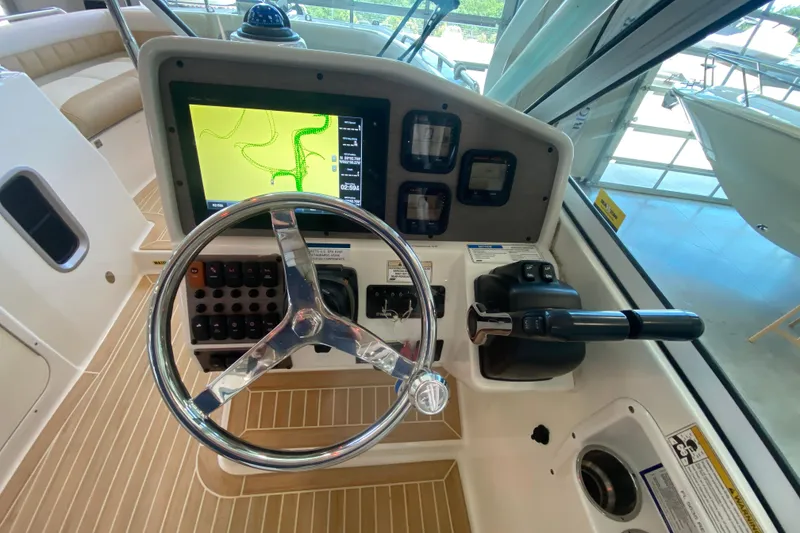 Slide: The Image of 2016 World Cat Glacier Bay Edition 2740 Dual Console helm with navigation display and controls. - 44