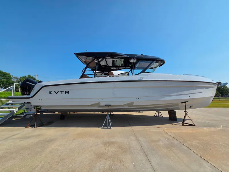 Slide: The Image of The 2027 Cruisers Yachts 38 VTR is on a dry dock. It features a sleek, modern design. - 0