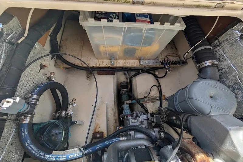 Slide: The Image of Engine compartment of a 2008 Ranger 2510 Bay Ranger boat, showing hoses and components. - 44