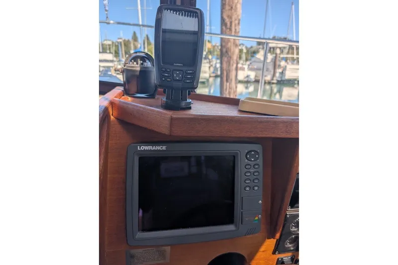 Slide: The Image of 2008 Ranger 2510 Bay Ranger boat dashboard with Lowrance and Garmin navigation systems. - 29