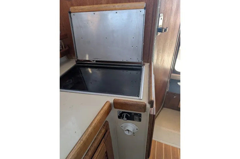 Slide: The Image of Interior of 2008 Ranger 2510 Bay Ranger boat with stove and wooden cabinetry. - 35