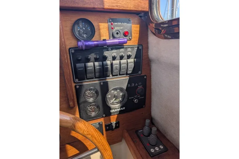 Slide: The Image of Control panel of a 2008 Ranger 2510 Bay Ranger boat with gauges and switches. - 30