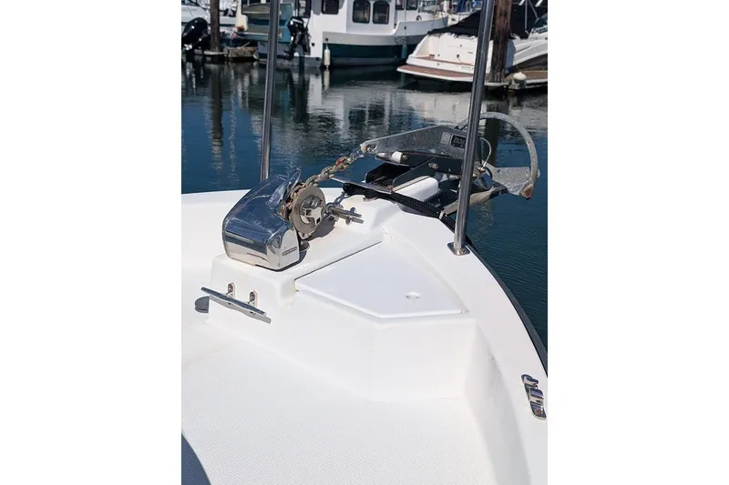 Slide: The Image of 2008 Ranger 2510 Bay Ranger boat bow with anchor system in marina. - 19