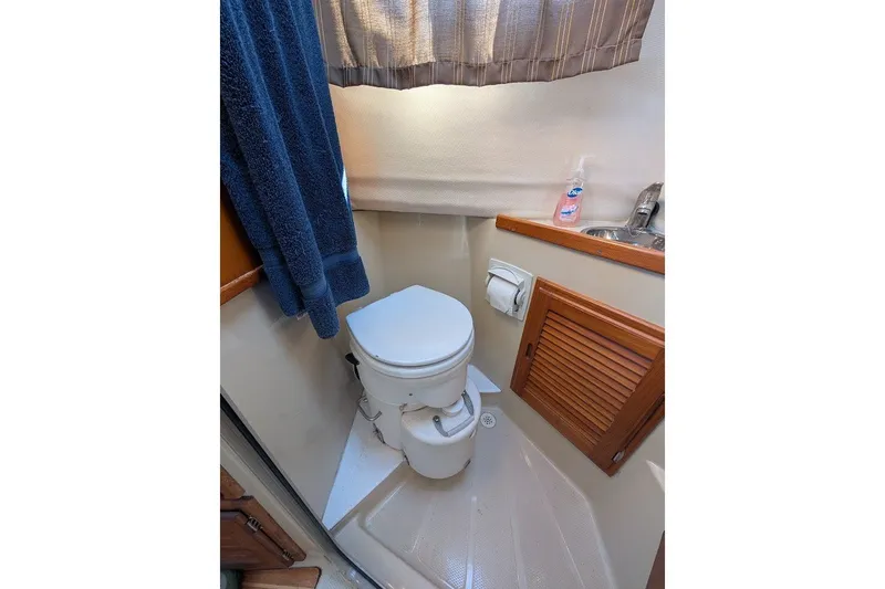 Slide: The Image of Compact bathroom in 2008 Ranger 2510 Bay Ranger boat with toilet and sink. - 37