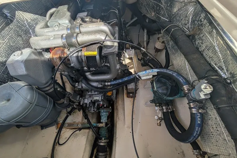 Slide: The Image of Engine compartment of a 2008 Ranger 2510 Bay Ranger boat, showing detailed mechanical components. - 42