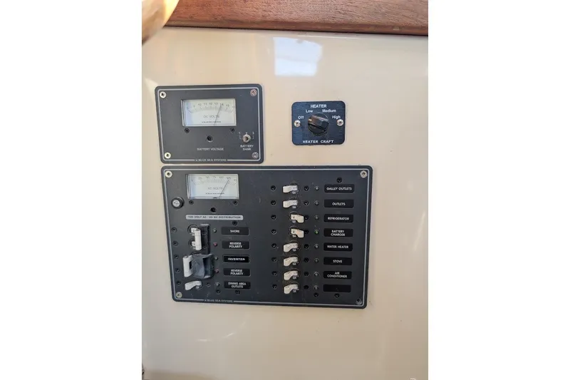 Slide: The Image of Control panel of a 2008 Ranger 2510 Bay Ranger boat with switches and gauges. - 33