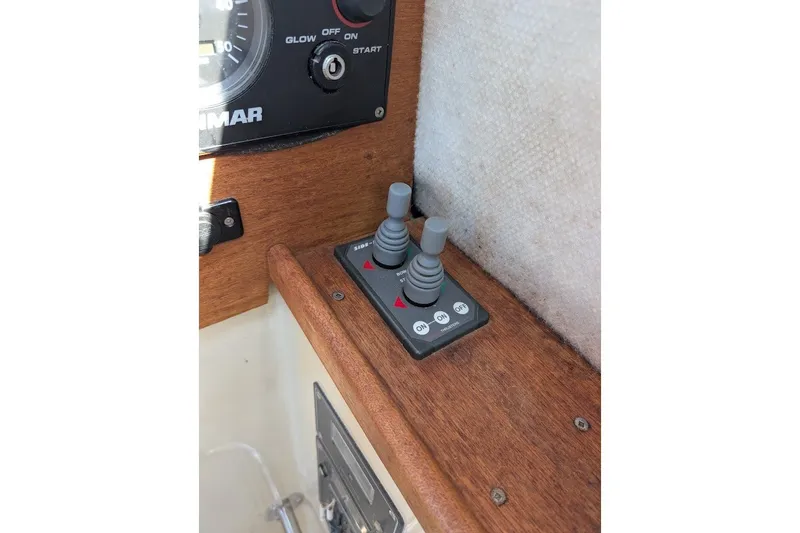 Slide: The Image of Control panel of a 2008 Ranger 2510 Bay Ranger boat with switches and dials. - 31