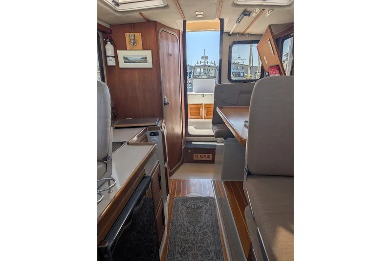 Slide: The Image of Interior of 2008 Ranger 2510 Bay Ranger boat with seating and kitchenette. - 36