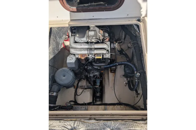 Slide: The Image of Engine compartment of a 2008 Ranger 2510 Bay Ranger boat, showcasing mechanical components. - 48