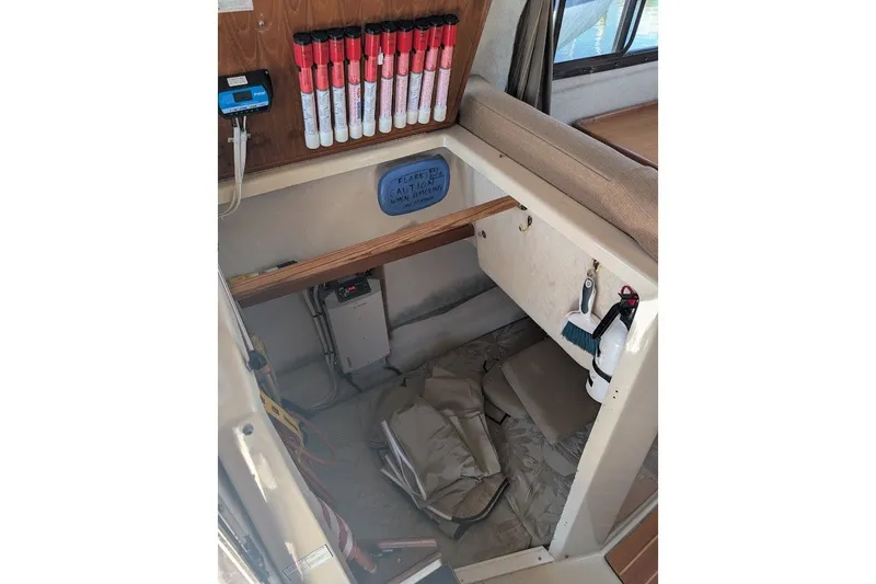 Slide: The Image of Interior storage area of 2008 Ranger 2510 Bay Ranger boat with safety equipment. - 24