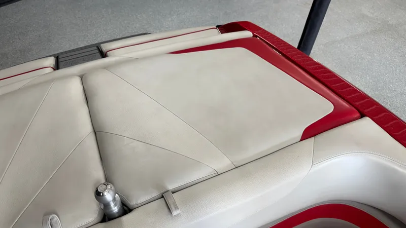Slide: The Image of Close-up of a boat seat with cream and red upholstery. - 20