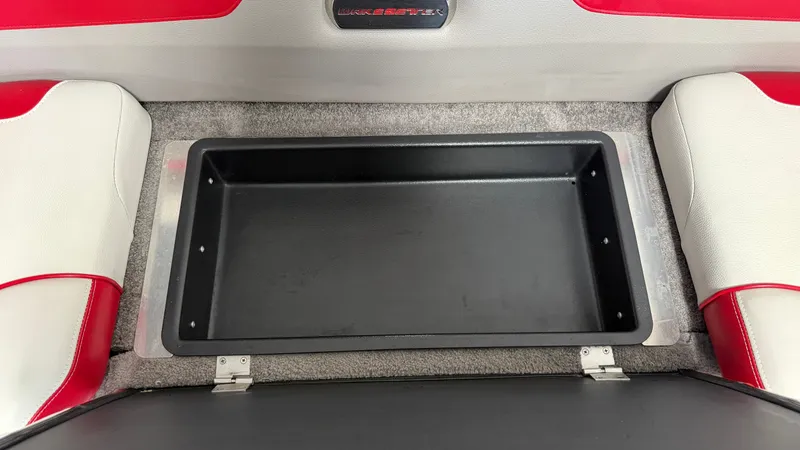 Slide: The Image of An open storage compartment inside a 2015 Malibu Wakesetter 23 LSV. - 41