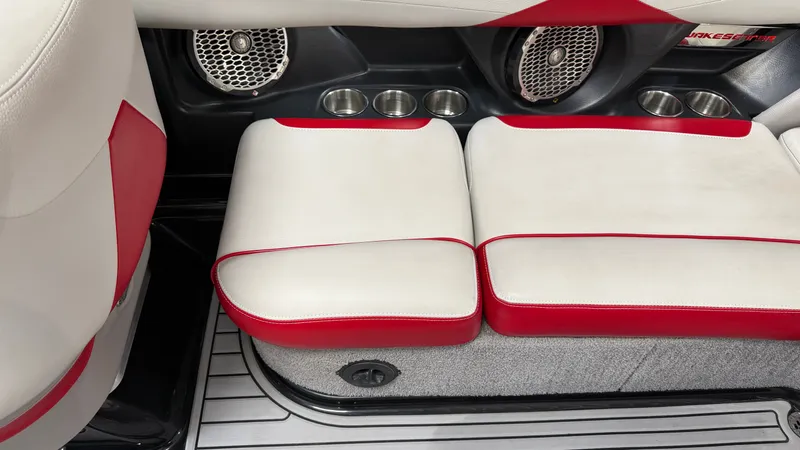 Slide: The Image of The interior of a 2015 Malibu Wakesetter 23 LSV with red and white seating. - 28