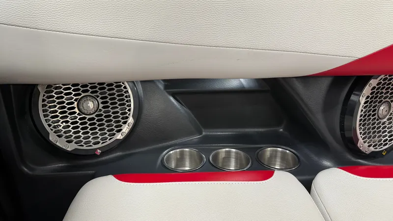 Slide: The Image of Close-up of a 2015 Malibu Wakesetter 23 LSV interior with speakers and cup holders. - 32
