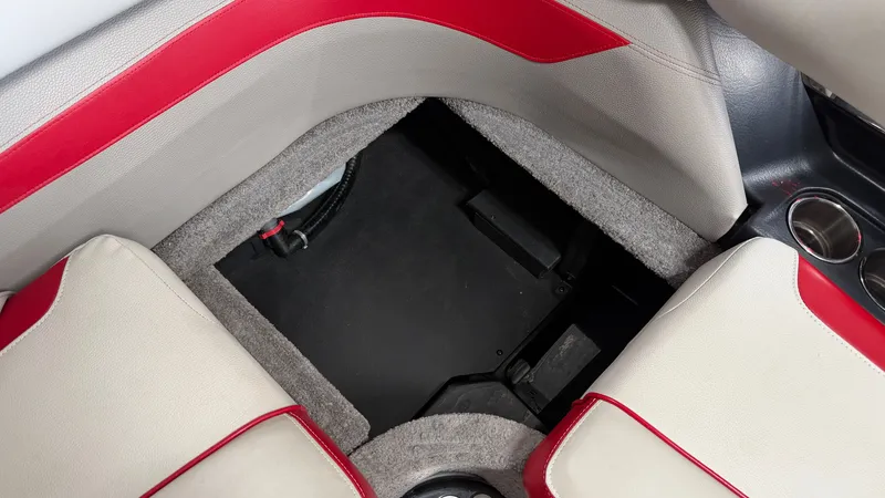 Slide: The Image of Interior of the 2015 Malibu Wakesetter 23 LSV with red and gray upholstery. - 45
