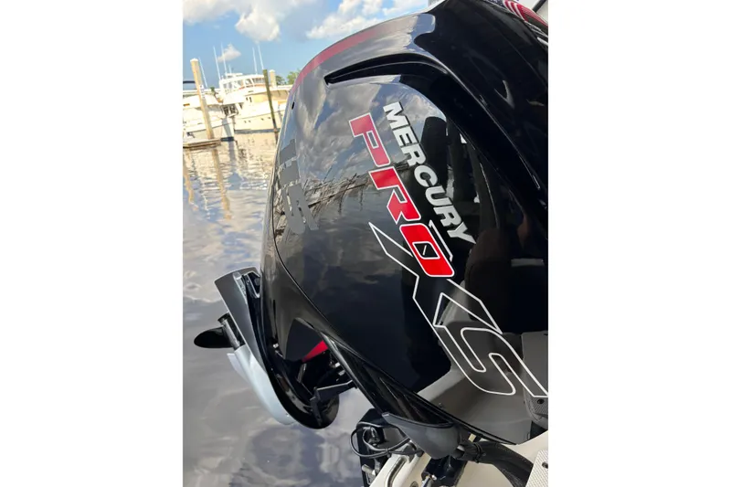 Slide: The Image of Mercury Pro XS engine on 2024 Pioneer 180 Islander boat at marina. - 6