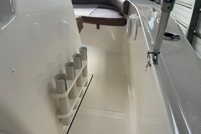 Slide: The Image of Interior view of 2024 Pioneer 180 Islander boat with rod holders and seating. - 20