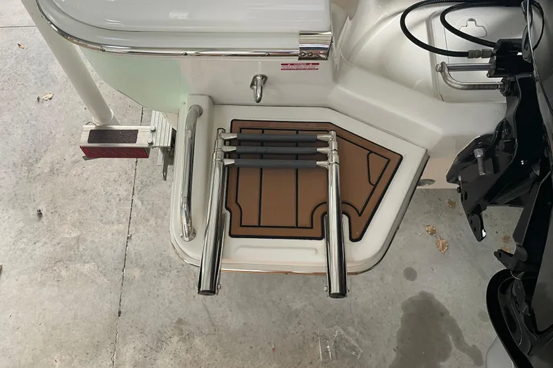 Slide: The Image of 2024 Pioneer 180 Islander boat swim platform with foldable ladder and non-slip mat. - 4