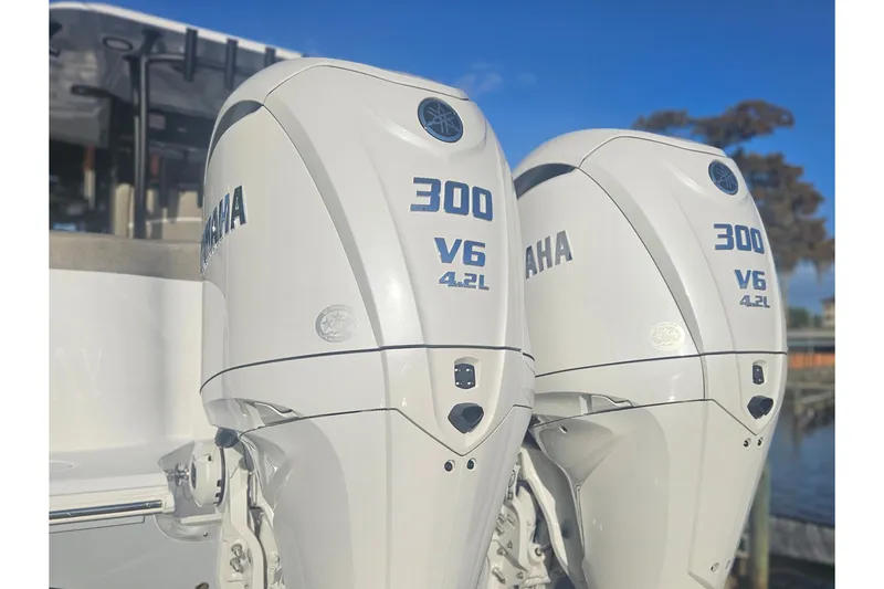 Slide: The Image of Twin Yamaha 300 V6 outboard engines on a 2026 Sea Hunt Ultra 285 SE boat. - 2