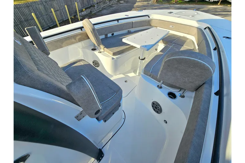 Slide: The Image of 2026 Sea Hunt Ultra 285 SE boat interior with seating and table setup. - 20