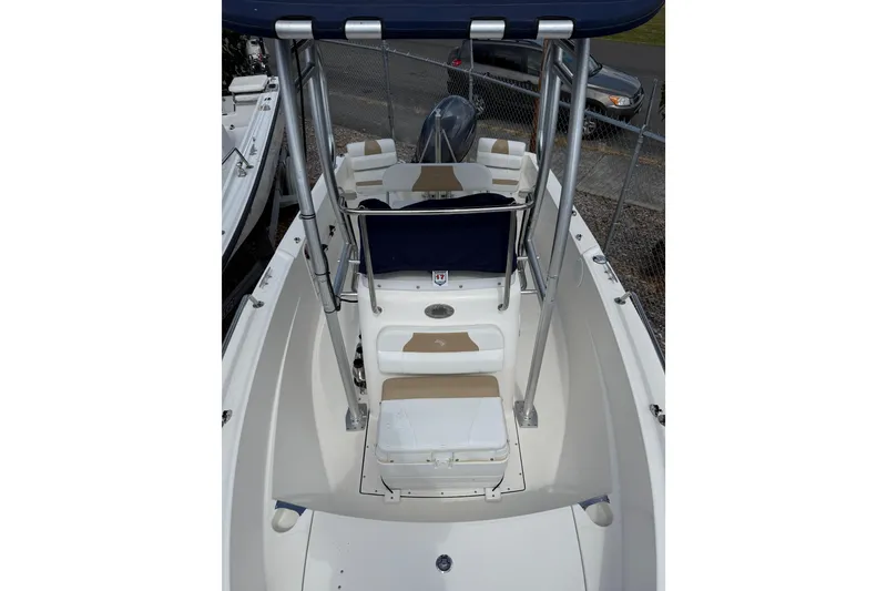 Slide: The Image of 2015 Edgewater 170CC boat interior with seating and console, viewed from above. - 15