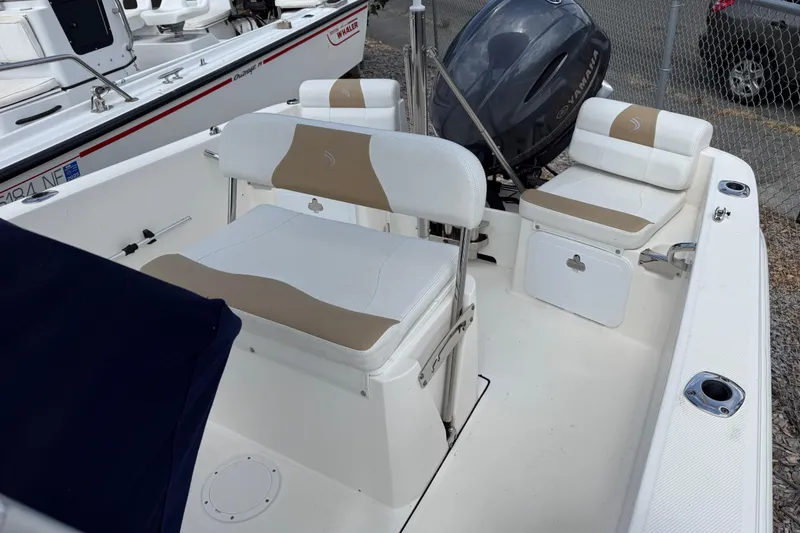 Slide: The Image of 2015 Edgewater 170CC boat interior with seating and Yamaha outboard motor. - 13