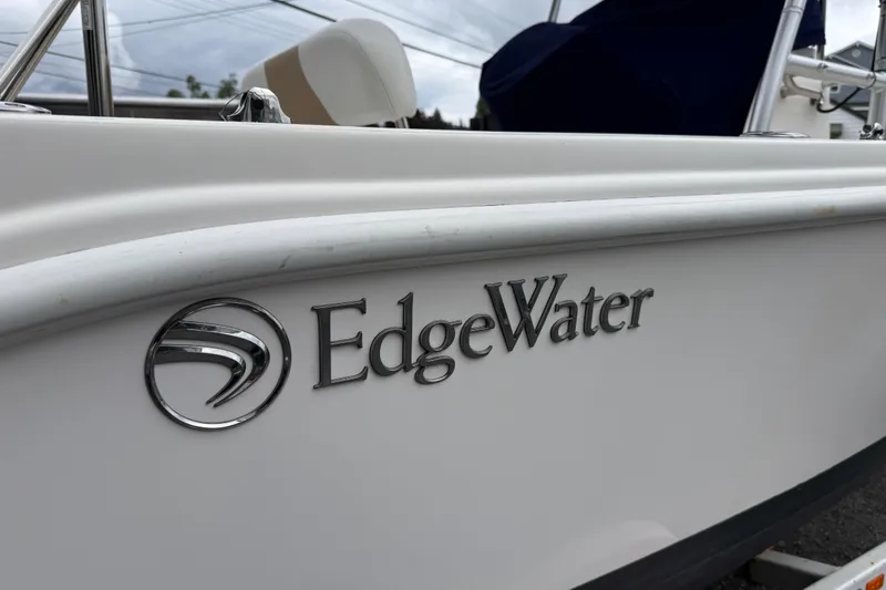 Slide: The Image of Edgewater 170CC 2015 boat logo on white hull, close-up view. - 3