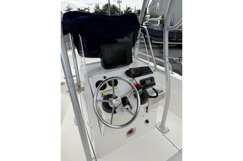 Slide: The Image of 2015 Edgewater 170CC boat console with steering wheel and navigation equipment. - 7