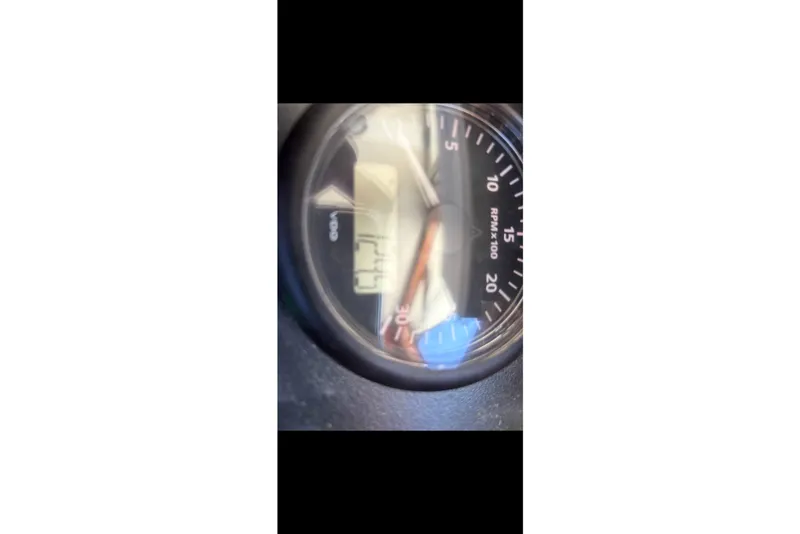 Slide: The Image of Close-up of a SeaPiper 35 tachometer displaying RPM, model year 2020. - 21
