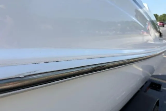 Slide: The Image of 2024 Tahoe T21 boat close-up, showcasing sleek white hull design. - 25
