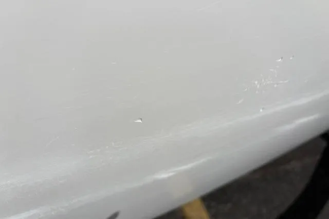 Slide: The Image of Close-up of a 2024 Tahoe T21 surface with minor scratches. - 21