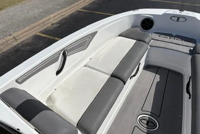 Slide: The Image of 2024 Tahoe T21 boat interior with gray and white seating, modern design. - 15