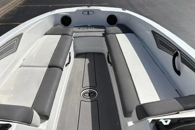 Slide: The Image of 2024 Tahoe T21 boat interior with gray seating and sleek design. - 14