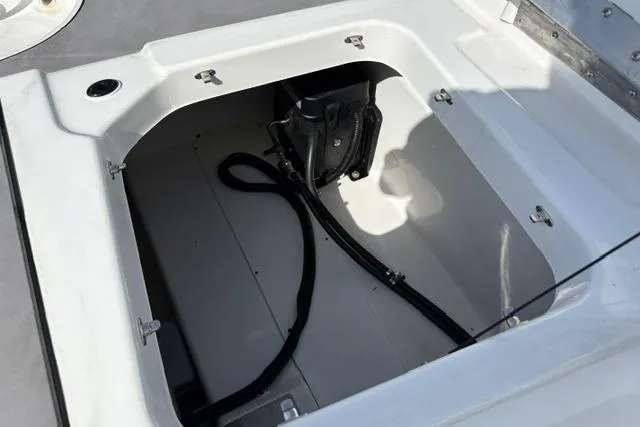 Slide: The Image of 2024 Tahoe T21 boat storage compartment with cables and equipment. - 30