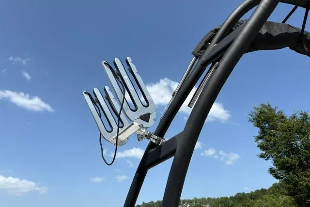Slide: The Image of Wakeboard rack on 2024 Tahoe T21 boat against clear blue sky. - 20