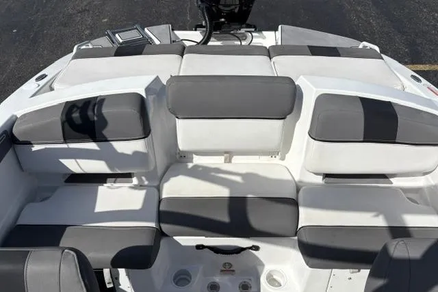 Slide: The Image of 2024 Tahoe T21 boat interior with gray and white cushioned seating arrangement. - 10