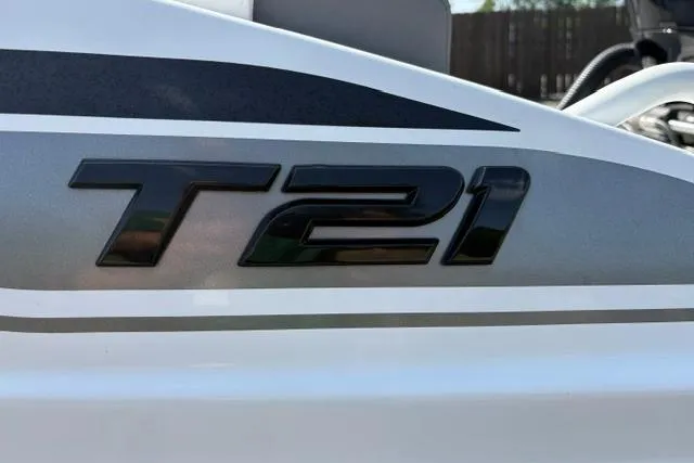 Slide: The Image of Close-up of 2024 Tahoe T21 model emblem on a sleek white surface. - 34